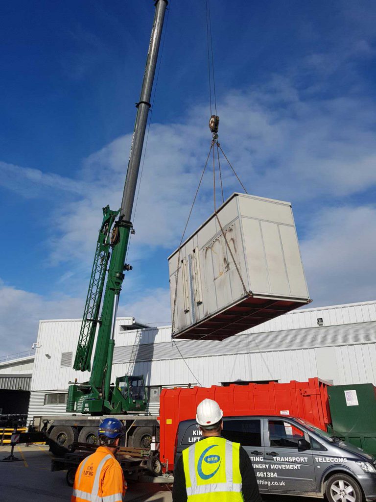 Crane lifting AHU onto roof